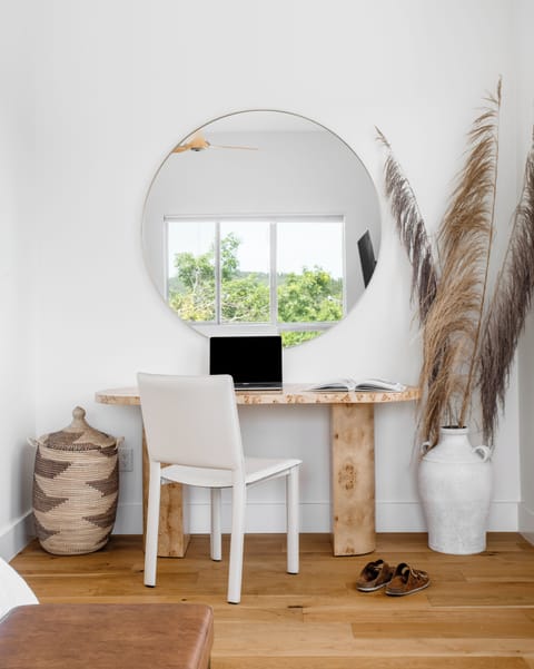 Desk area in third floor primary bedroom, located on the west side of the house.