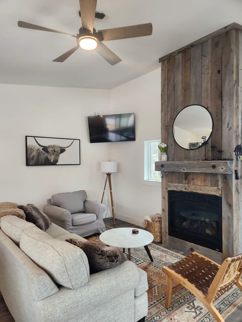 Comfortable open living room with gas fireplace 