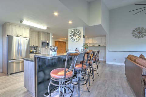 View into kitchen with breakfast bar seating