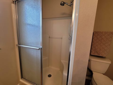 Combined shower/tub, hair dryer, towels, soap