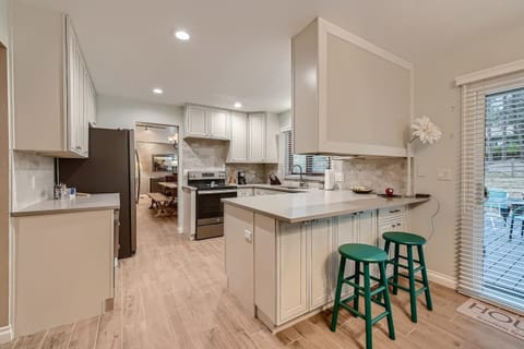 With bar stools and a kitchen table with much seating, this kitchen also provides an inviting space for hanging out with your loved ones.