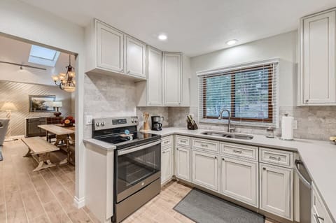 The kitchen connects directly to the dining room area and is fully equipped for you to whip up any gourmet meal.