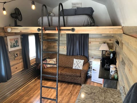 Ladder leads to a cozy loft w/comfy full-size bed.