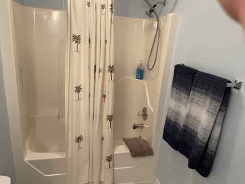 Combined shower/tub, hair dryer, towels, soap