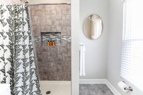 Combined shower/tub, hair dryer, towels, soap