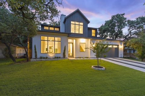 Front of this beautiful two-story house at night