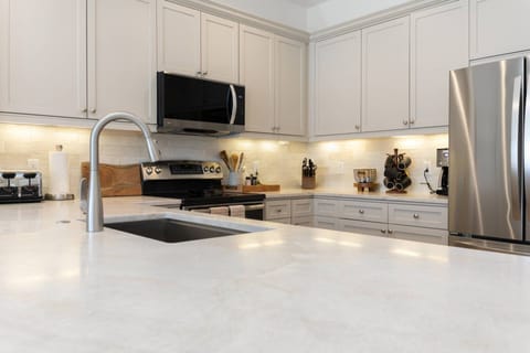 Your Designated Chef will Find More Than Enough Space in this Newly Updated Kitchen with Sleek Quartzite Countertops!