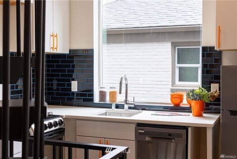 Full kitchen with microwave, oven, stove, refrigerator, and dishwasher