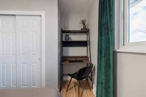 - Stay productive with a dedicated desk and comfy chair nestled into a quiet corner
- Natural light from the window makes this a perfect spot for work or journaling
- Shelves with charming decor and essentials keep your workspace organized and inspir
