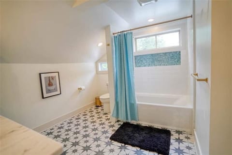 Combined shower/tub, hair dryer, towels, toilet paper