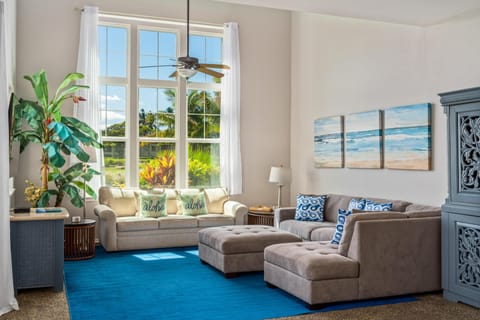 Spacious living room with tall windows