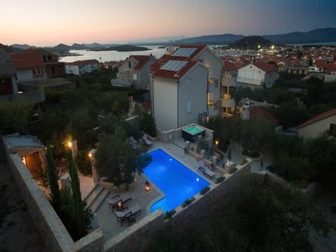 A heated pool, sun loungers