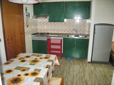 Fridge, cookware/dishes/utensils, dining tables