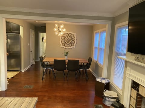 Dining room open to living room and kitchen. Seating for 6+