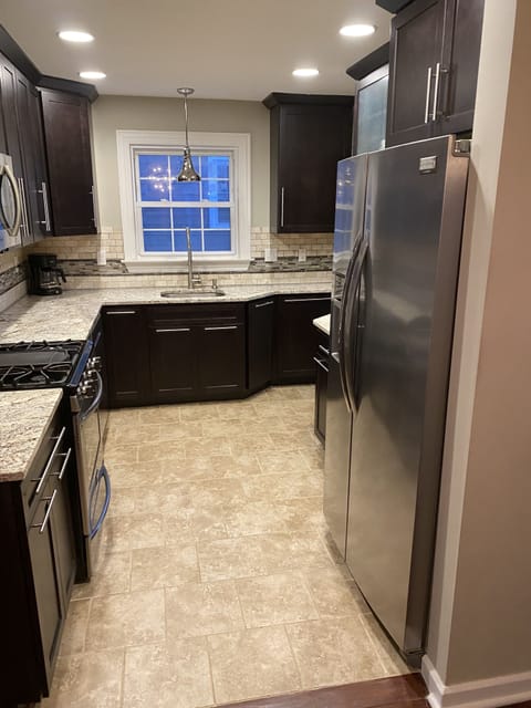 Kitchen, fully stocked with stainless appliances and gas cooktop