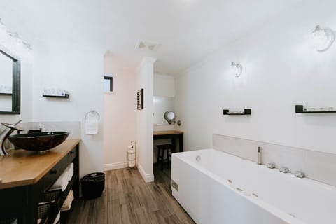 Bathtub, eco-friendly toiletries, hair dryer, towels