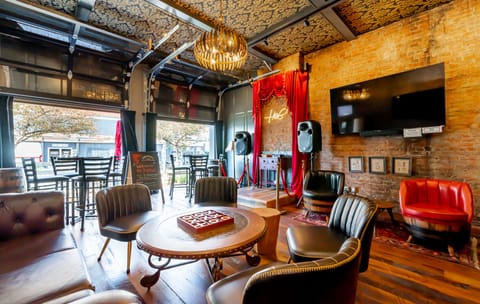 The speakeasy lounge awaits you. Open the garage doors in beautiful weather so the passer buyers can applaud your karaoke magic!