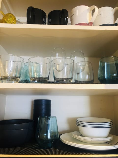 Microwave, coffee/tea maker, cookware/dishes/utensils, dining tables