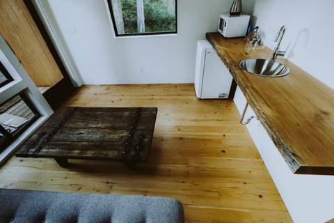 Each of five guesthouses includes a living area with wet bar and fold-down sofa