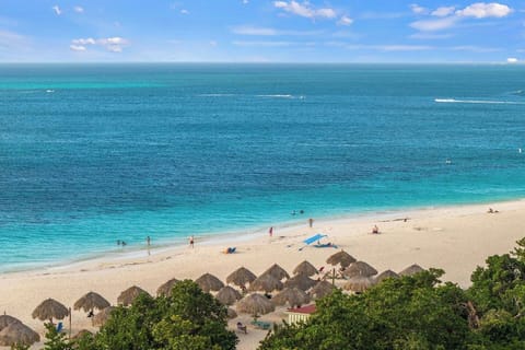 On the beach, sun loungers, beach towels