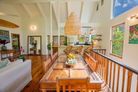 Teak wood custom dining table with glass top, seats 8. 15' wood slab bar seats 4