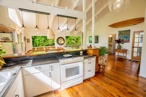 Stocked kitchen with basin stainless steel sink & 15ft Acacia wood kitchen bar.