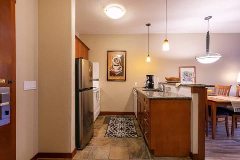 Full kitchen featuring stainless steel appliances, complete cookware and everything you need to whip up a hearty breakfast before hitting the slopes