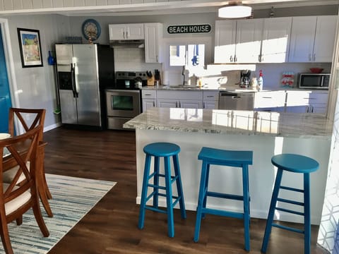 Large Kitchen with granite countertops. Island seats 3. Refrigerator w/icemaker