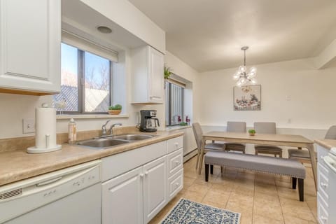 Bathed in natural light, this quaint kitchen creates a warm and welcoming space.