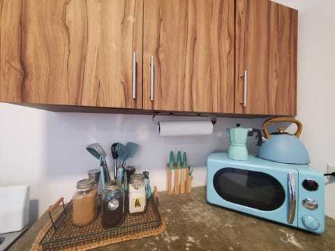 Fridge, microwave, stovetop, coffee/tea maker