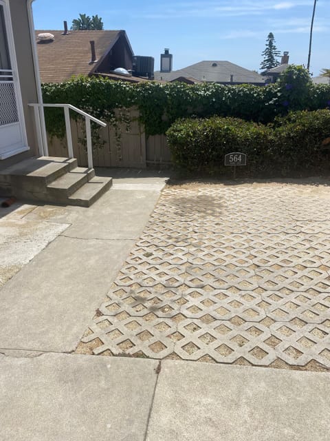 Reserved off-street parking at the back door.