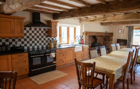 Beamed, traditional, farmhouse kitchen