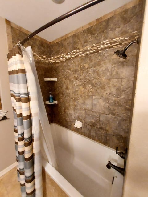 Combined shower/tub, towels, soap, toilet paper