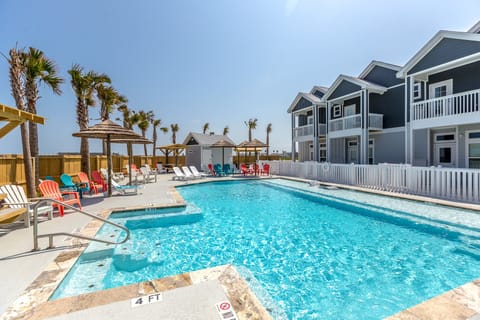 A heated pool, sun loungers