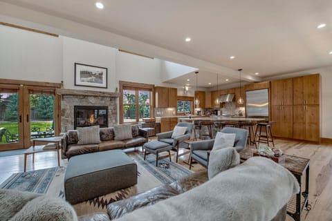 living room looking at kitchen and back yard