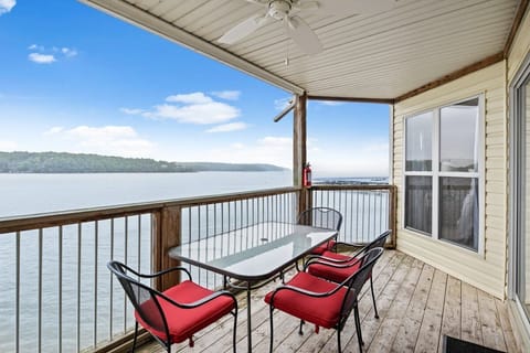 Large covered deck with seating, main channel lake view and propane grill