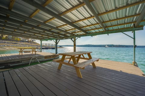 Large dock with 2 picnic tables, boat slip and a jet ski dock area. 