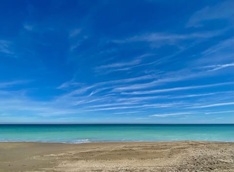 On the beach, sun loungers, beach towels