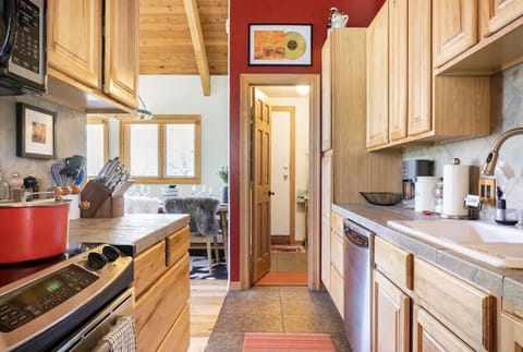 The kitchen provides convenient access to the dining area and BBQ on rear deck.