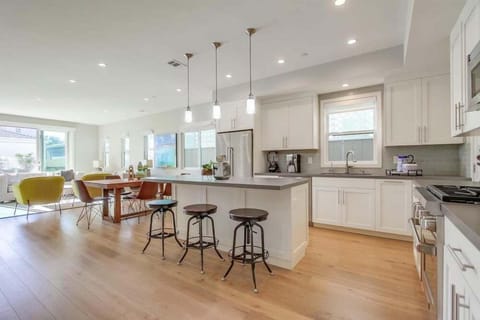 Bright, Open, Spacious kitchen + dining + living room