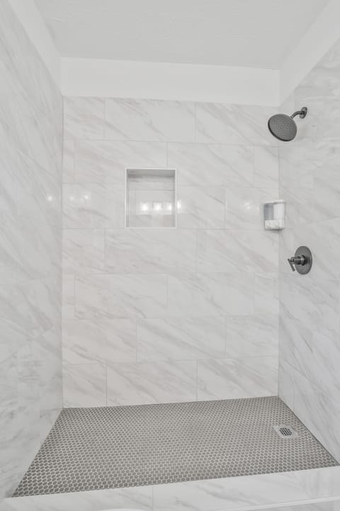 Combined shower/tub, hair dryer, towels, soap