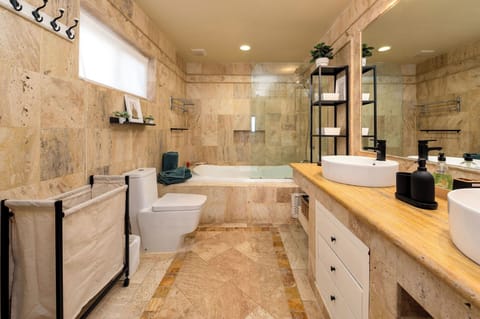 Combined shower/tub, hair dryer, towels, soap