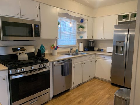 Spacious kitchen with stainless steel appliances.