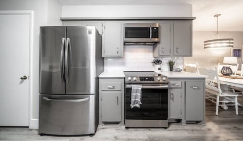 kitchen opens to dining and living rooms