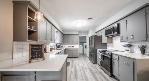 kitchen with new quartz counters and appliances