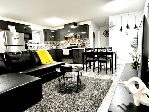 Living room with comfortable leather sofa bed, LG TV with over 2000 channels. 