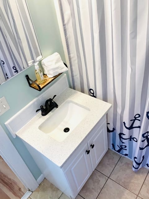 Combined shower/tub, hair dryer, towels, toilet paper