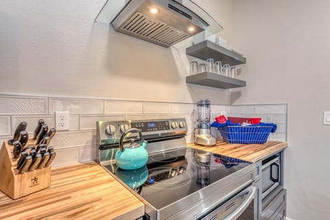 Enjoy cooking in this spacious kitchen with ample counter space and top-tier amenities.