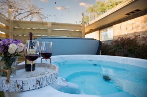 Have a glass of wine while relaxing in the hot tub