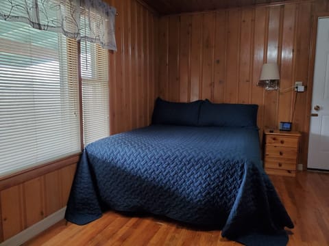 1st Bedroom - queen bed, television, ceiling fan and separate entrance.